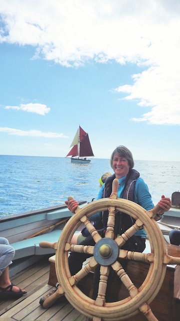 Sue at the helm, in Torbay with Golden Vanity (photo by Jo Coomber).JPG